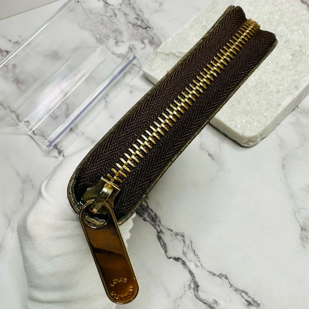 EUC Louis Vuitton Monogram Groom Zippy Organizer Wallet Alpine Green